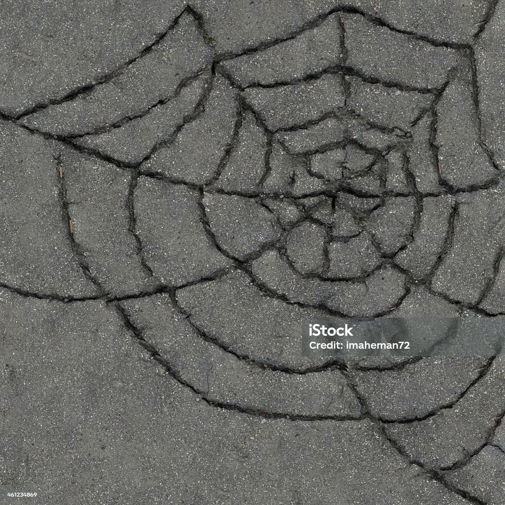 Spiderweb from the cracks. Asphalt Asphalt - spiderweb from the cracks. Halloween background Abstract Stock Photo