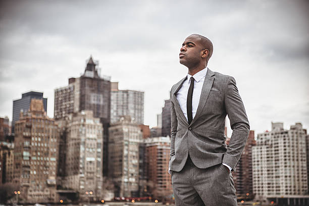 istock Successful business man looking away against the skyline 461237001