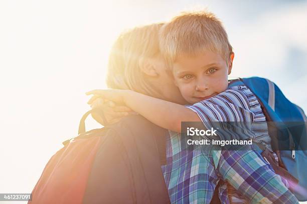 Mother And Son Hugging Stock Photo - Download Image Now - Backpack, Child, Boys