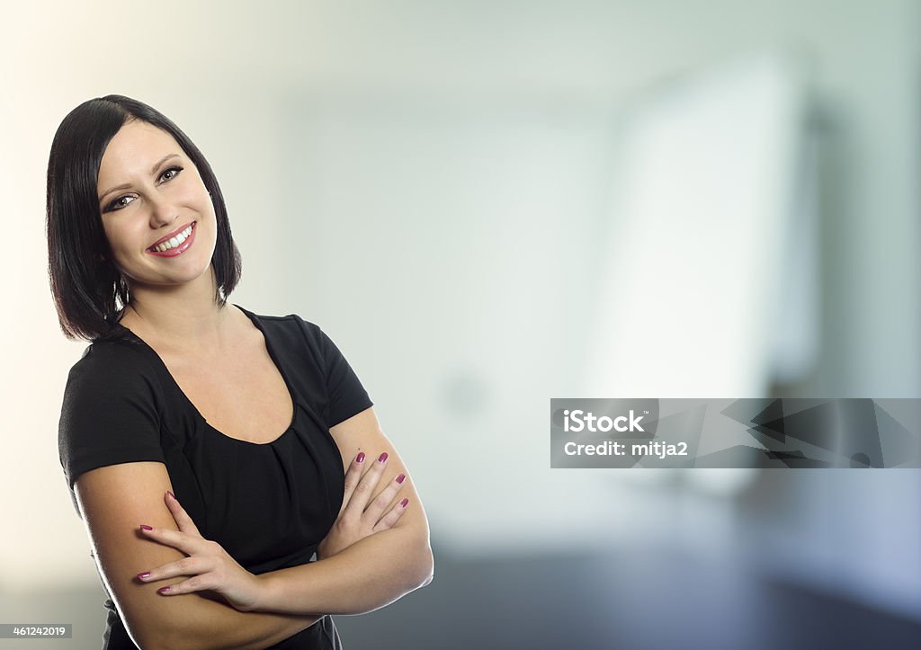 Modern Businesswoman Young beautiful modern businesswoman in office. 20-24 Years Stock Photo