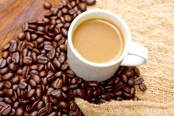 istock Coffee and beans on the wooden background. 461244157