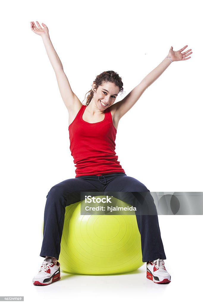Sport woman with a pilate ball young woman exercising with a yellow pilate ball 20-29 Years Stock Photo