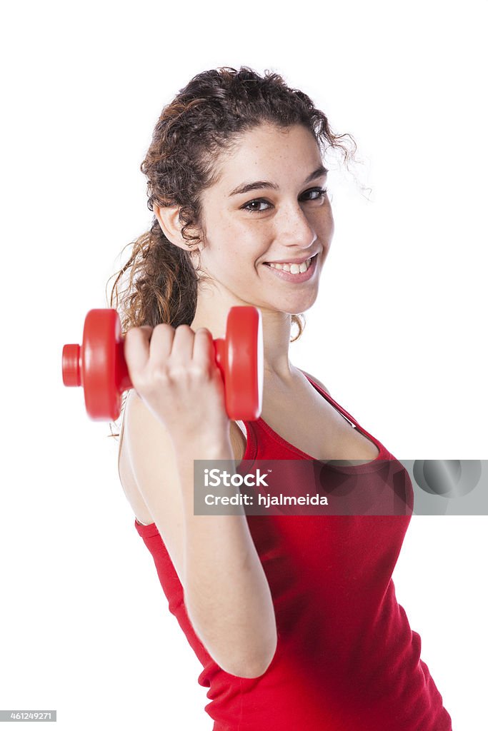 Wealthy woman exercising young woman exercising her muscle with dumbbell (isolated on white) 20-29 Years Stock Photo