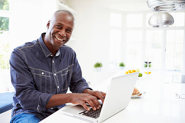 istock African American Man Using Laptop At Home 461259795
