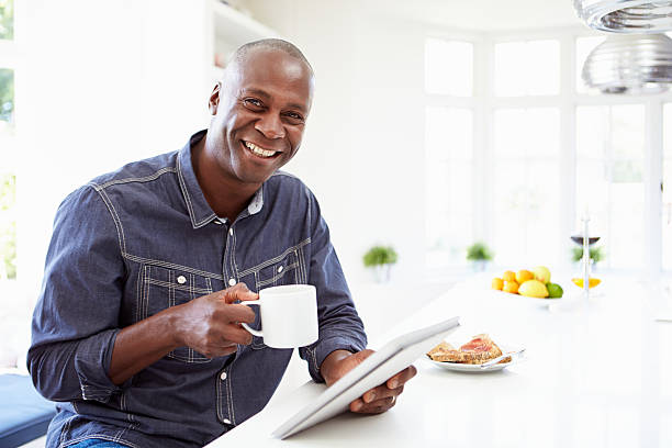 istock African American Man Using Digital Tablet At Home 461262047