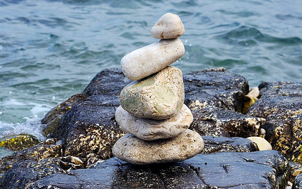 istock Stones in balance on the sea 461262449