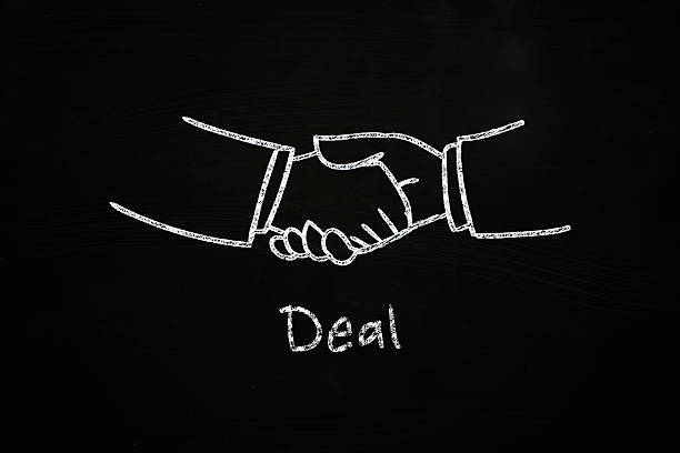 istock Chalk drawing of a deal being done 461265039