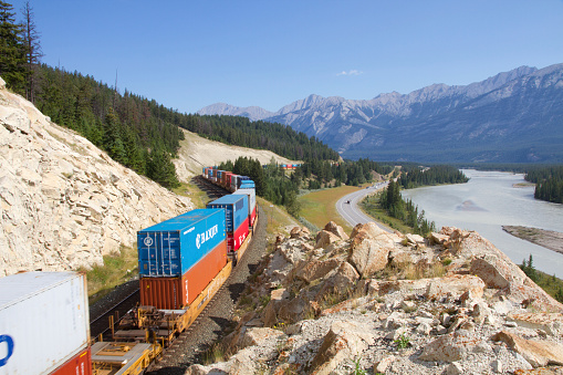 Jasper National Park, Alberta Canada - Aug 12th, 2013. CN cargo train travelling eastward. Specific location is 2 km east of Jasper town site (in Jasper National Park) alongside Highway 16.