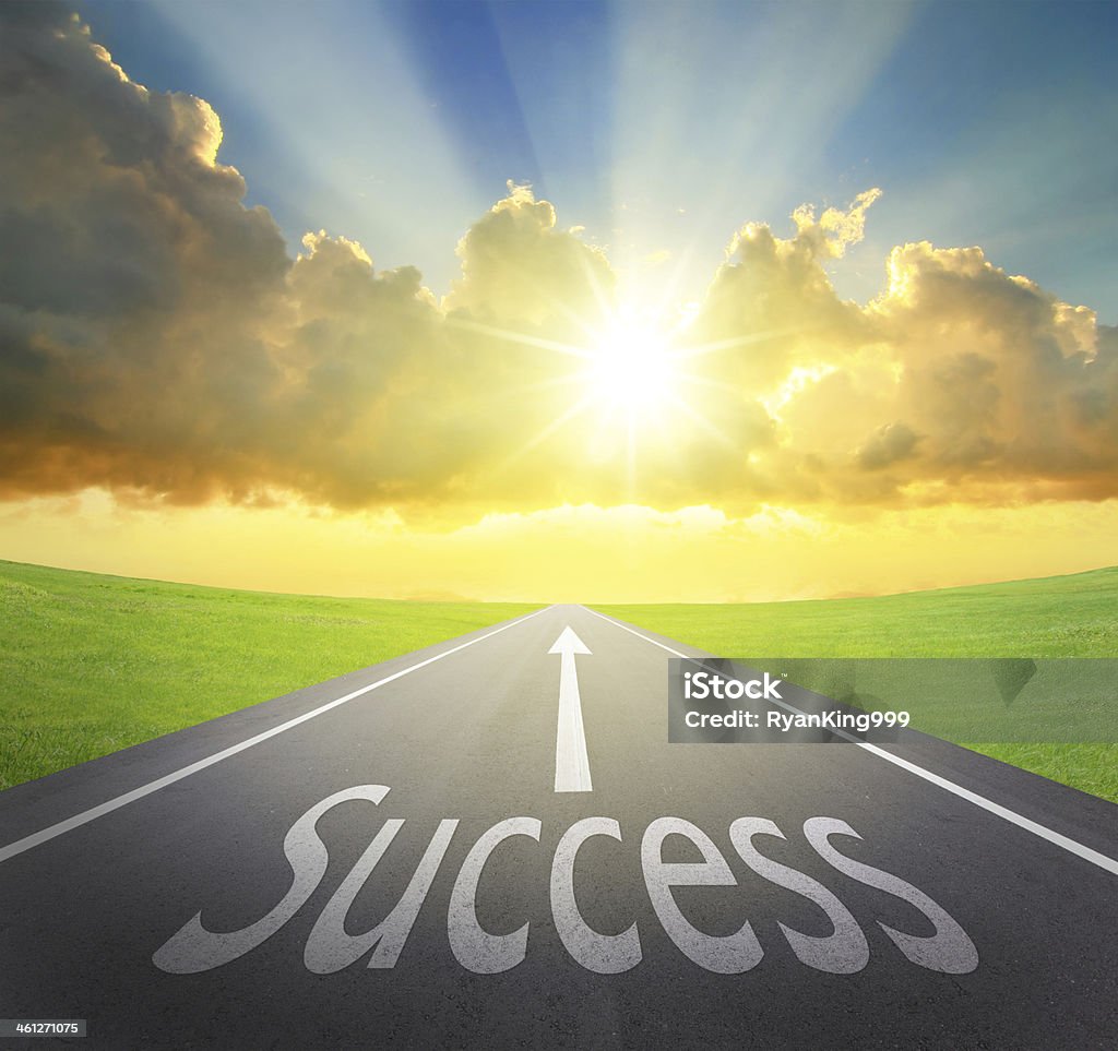 Way to Success Way to Success, road symbolizing the improvement of success and sunrise with asphalt road and green grass, great for your design and concept Grass Stock Photo