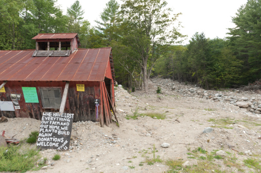 A small shed destroyed by flood waters from Hurricane Irene in Vermont, USA. The sign reads \