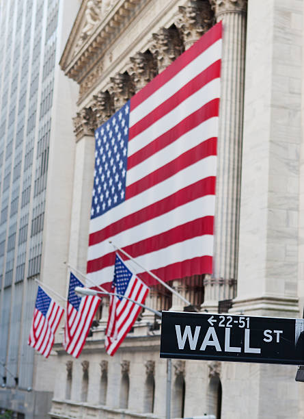 istock Wall Street Sign with US Flag Behind 461280107
