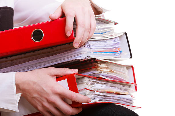 istock Female hands holding stack folders documents. Overworked business woman. 461286087