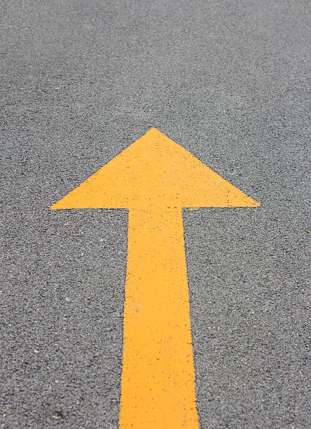 istock Yellow arrow up on asphalt street 461287281