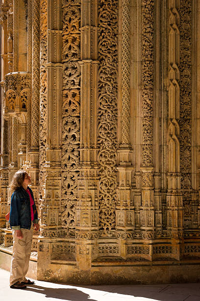 Portal of Unfinished Chapels in Batalha Abbey, Portugal A detail of a portal of the Unfinished Chapels in Batalha Abbey, Portugal. Mosteiro Santa Maria da Vitória, more commonly known as the Batalha Monastery, is a Dominican convent in the Portuguese town of Batalha. It is one of the best and original examples of Late Gothic architecture in Portugal, intermingled with the Manueline style. batalha abbey photos stock pictures, royalty-free photos & images