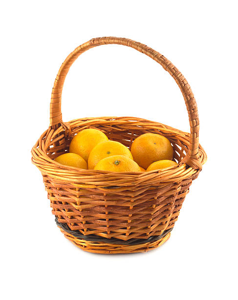istock Tangerines in brown wicker basket isolated 461289297