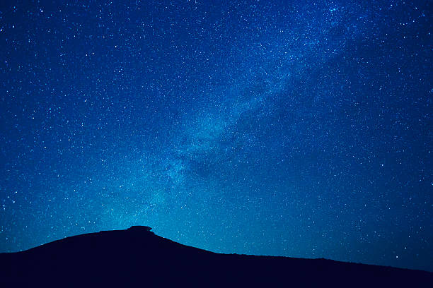 istock Milky way stars at night 461294871