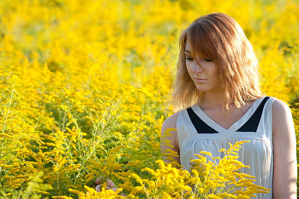 istock girl in the rapeseed field 461297319