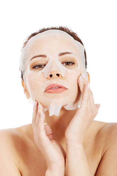 istock Beautiful spa woman with collagen mask. 461297649