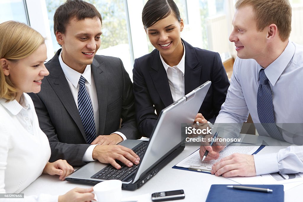 Successful business plan Group of businesspeople gathered to have a discussion about business plan Adult Stock Photo