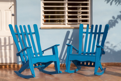 Rocking chairs in front of a home on Cuba