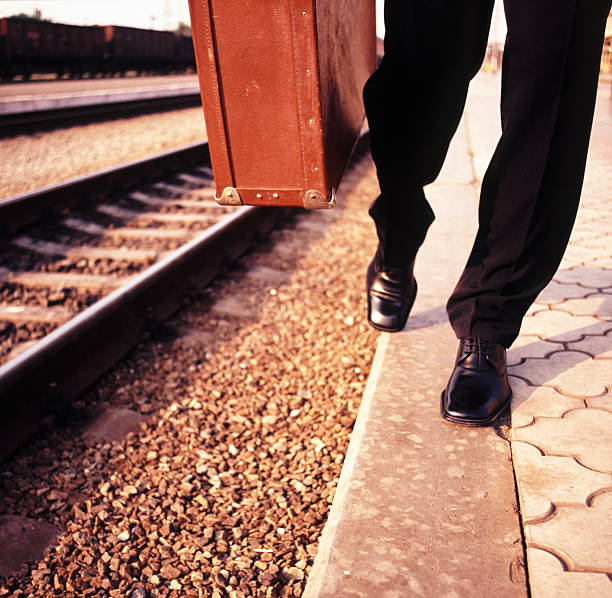 istock male legs and suitcase 461301381