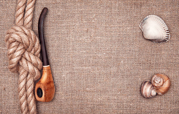 istock Ship rope, seashells and tobacco pipe 461302441