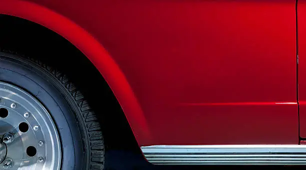 Photo of close-up of red car side