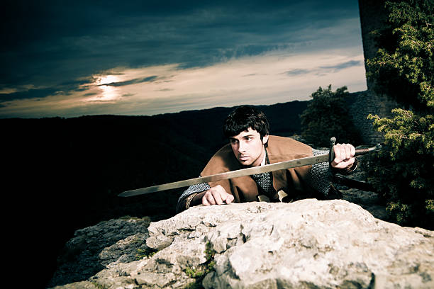 istock knight posing in front of a fortress ruin 461306823