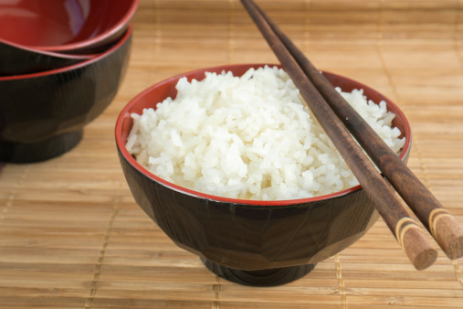 White steamed rice with chopsticks