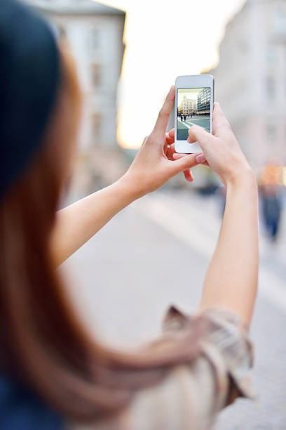 istock Young woman making photograph 461313163