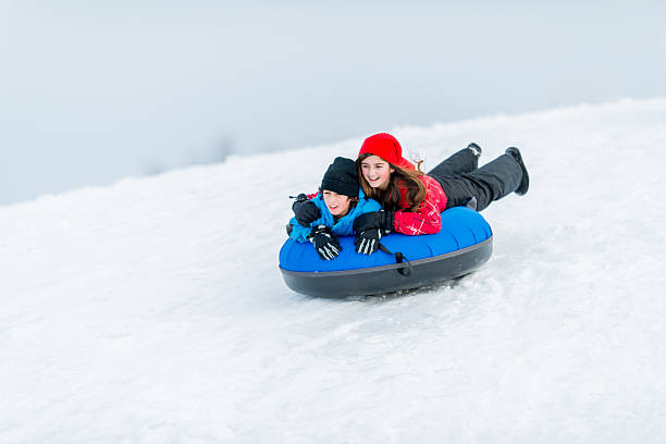 istock Family Fun in the Winter Snow 461313515