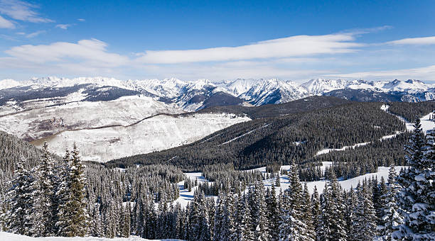 istock Forest Covered by Snow with Skiing Slopes and Rocky Mountains 461315007