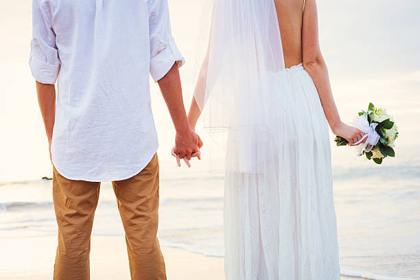 istock Bride and Groom, Romantic Newly Married Couple Holding Hands 461316765