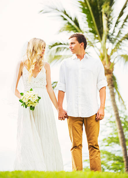 istock Bride and Groom, Romantic Newly Married Couple Holding Hands 461316815