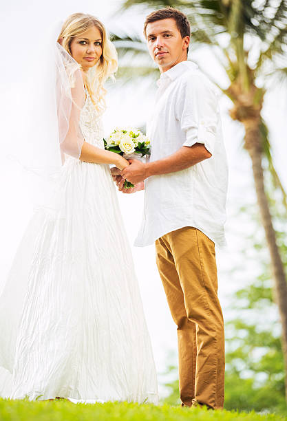 istock Bride and Groom, Romantic Newly Married Couple Holding Hands 461316963
