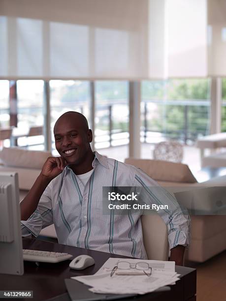 Man On A Computer At A Desk Stock Photo - Download Image Now - 30-34 Years, 30-39 Years, Adult