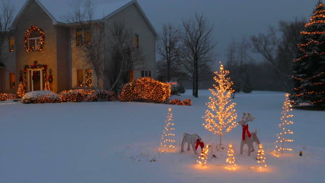 Home With Festive Outdoor Christmas/Holiday Lighting and Snow