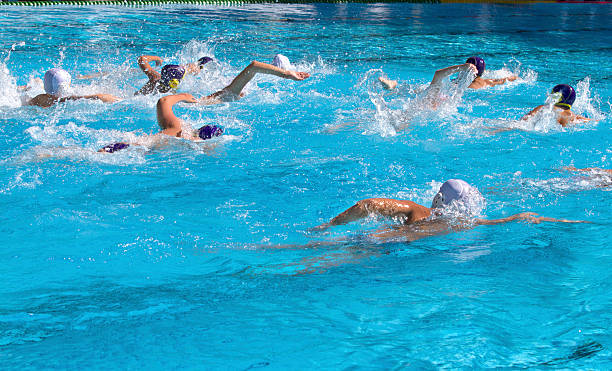 Group of people with swim caps swimming in a large pool Attack, Swimmers water polo photos stock pictures, royalty-free photos & images