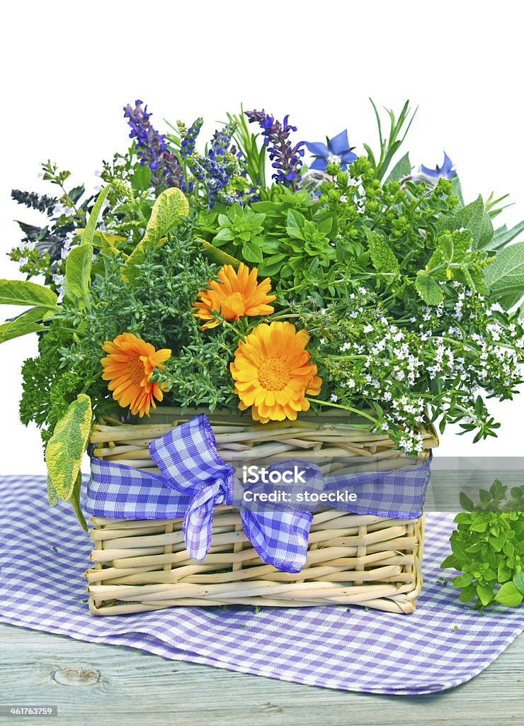 fresh herbs basket of fresh herbs and edible flowers Basket Stock Photo