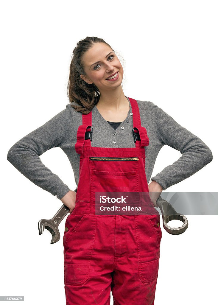 Girl worker with wrench Happy female worker with big wrench, isolated on white Women Stock Photo