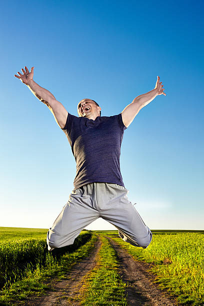 istock Jump for joy in the wheat field 461767365