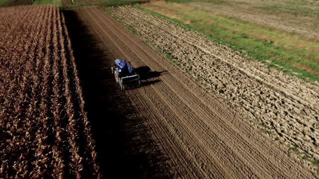 AERIAL Farmer Cultivating The Field