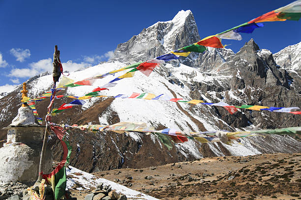 istock tabuche trekker with buddhism flag from nepal 461770263