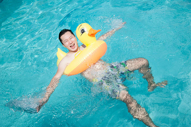 Close up of yellow rubber duck in the swimming pool