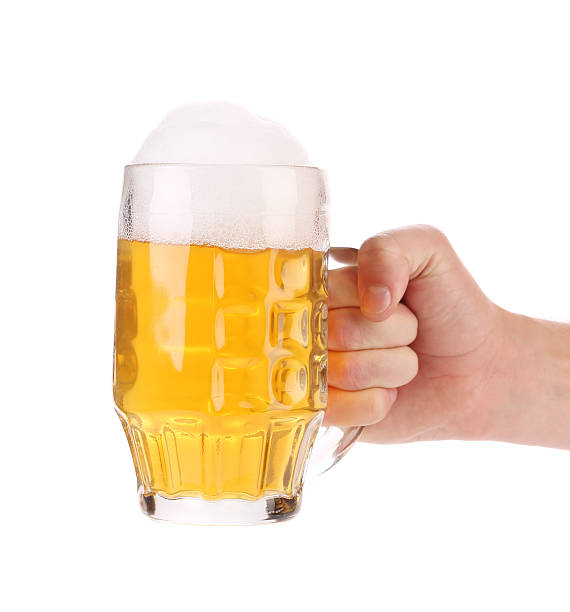 istock Man hand holds beer in mug. 461772155