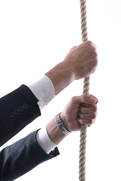 istock business man with rope isolated on white background 461773247
