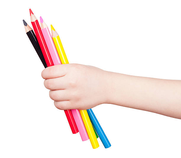 istock colorful pencil in child hand isolated 461785337
