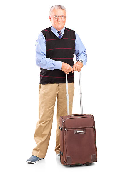 istock Senior gentleman standing with a travel bag 461789717