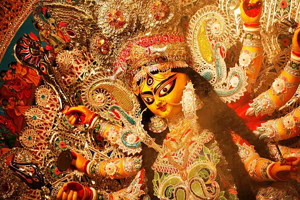 Durga Puja - the ceremonial worship of the mother goddess, is one of the most important festivals of India. Apart from being a religious festival for the Hindus, it is also an occasion for reunion and rejuvenation, and a celebration of traditional culture and customs. While the rituals entails ten days of fast, feast and worship, the last four days - Saptami, Ashtami, Navami and Dashami - are celebrated with much gaiety and grandeur in India and abroad, especially in Bengal, where the ten-armed goddess riding the lion is worshipped with great passion and devotion.