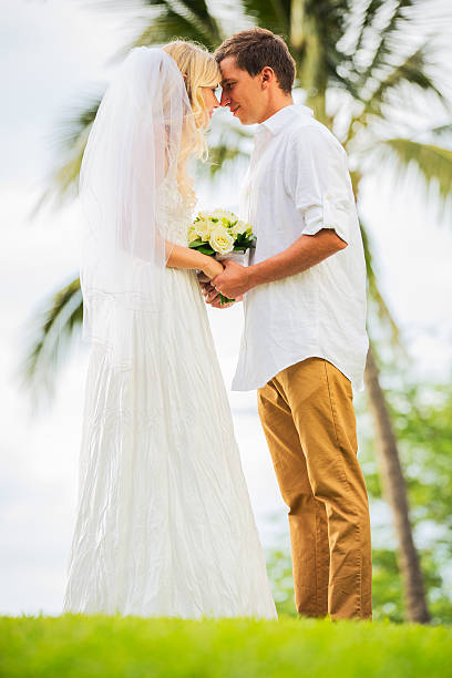 istock Just married couple holding hands 461795397